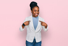Young African American Woman Wearing Business Clothes Looking Confident With Smile On Face, Pointing Oneself With Fingers Proud And Happy.