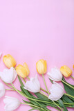 Fototapeta Tulipany - Bouquet of white tulips on pink background.