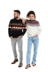 Sticker - Happy young couple in warm sweaters on white background