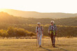 © pucko_ns - Old couple walking in nature and talk at sunset