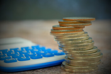 Poster - coins on table background and saving money and business growth concept,finance and investment concept, stack of coin on table and saving money