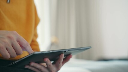 Poster - Young woman using a tablet PC in the room.