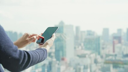 Poster - People using a smart phone in front of the city.