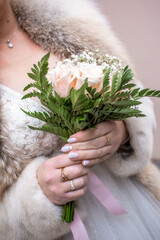 Sticker - bride holds a bouquet in her hands. close-up on a bouquet