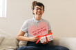 © (JLco) Julia Amaral - Cheerful woman with valentines card and gift