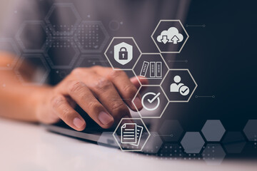 Leinwandbilder - Businessman employing a computer to document management, online documentation database technology, and digital file storage system or software, records management, file access, and doc sharing.