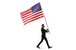 Full length profile shot of a businessman walking and carrying a big USA flag
