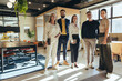 Leinwandbild Motiv Team of businesspeople standing together in an office
