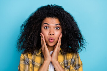 Poster - Photo of excited shocked lady hands cheeks open mouth wear checkered shirt isolated blue color background