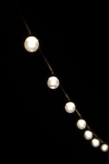 Wall Mural - garlands of light bulbs in the dark