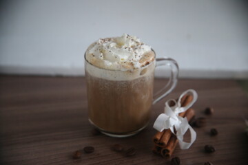 coffee latte with cream and cinnamon on the table beverage dribks hot mug bitter cappuccino brown aroma cafe