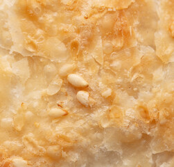 Poster - Sesame seeds on a golden brown crust of bread as a background.