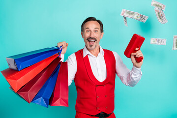 Sticker - Photo of cheerful aged man wealthy spend money shopping store win lottery isolated over teal color background