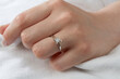 © kamil - Jewelry background. Diamond ring on woman hand
