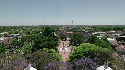 Wall Mural - Aerial view of the central square of Chascomus, a city located in the province of Buenos Aires, Argentina. Full of green trees and its immense lagoon.
