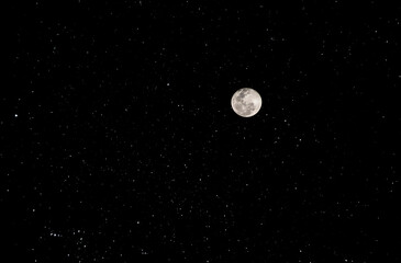 beautiful full moon with black and starry sky