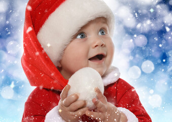 Wall Mural - Cute baby in Christmas costume against blurred festive lights, closeup