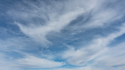 Wall Mural - wispy clouds and blue sky suitable for background or sky replacement