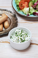 Canvas Print - A bowl of cottage with chives.