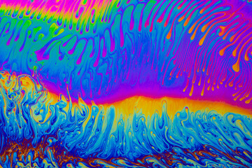 Wall Mural - psychedelic multicolored background abstract. rainbow colors. patterns background. photo macro shot 