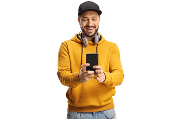 Poster - Smiling young man with headphones around neck and a cap using a smartphone and smiling