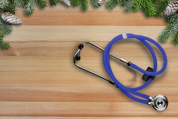 Sticker - Medical stethoscope with green fir tree branches, Merry Christmas and Happy New Year medicine concept.