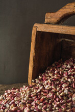 Typical Mexican Red Corn On A Wooden Panel, A Traditional Measure In Central And South America To Calculate The Grains.