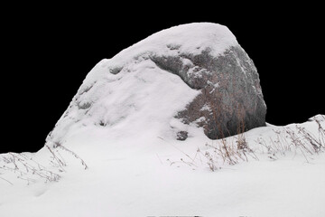 Canvas Print - natural stone in snow isolated on black background