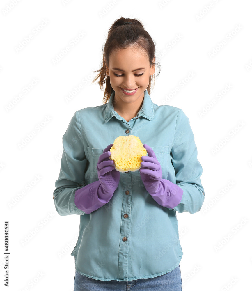 Young woman with sponge on white background
