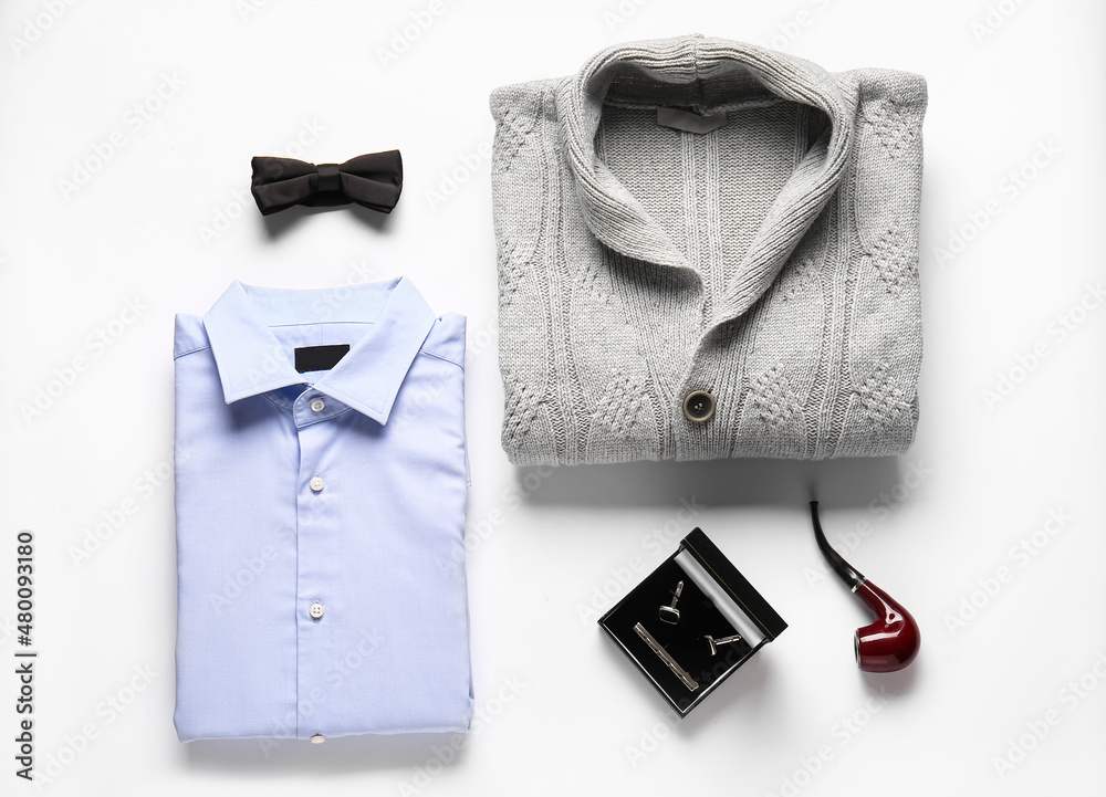 Male sweater, shirt and accessories on white background