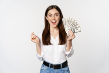 Enthusiastic Woman Showing Money, Cash And Smiling, Got Loan, Micro Credit, Standing Delighted Against White Background