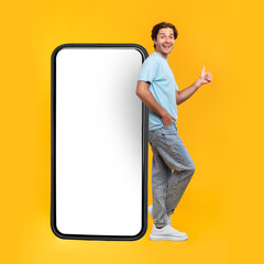 Poster - Man showing white empty smartphone screen and ok sign