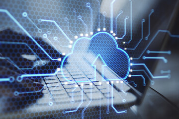 Poster - Close up of hands using laptop keyboard with abstract glowing cloud and chip interface on blurry background. Cloud computing, technology and database. Double exposure.