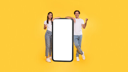 Poster - Couple showing white empty smartphone screen and gesturing yes