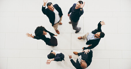 Aufkleber - Happy staff aim high. High angle shot of a group of businesspeople raising their hands in triumph in a modern office.