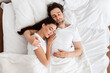 © Prostock-studio - Married Couple Sleeping Embracing In Comfortable Bed Indoor, Top View