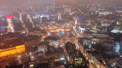 Wall Mural - Aerial drone night shot of illuminated Trafalgar square as seen at Christmas time, Westminster, London, United Kingdom