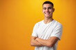 © fotofabrika - Portrait of a teen boy smiling against yellow background
