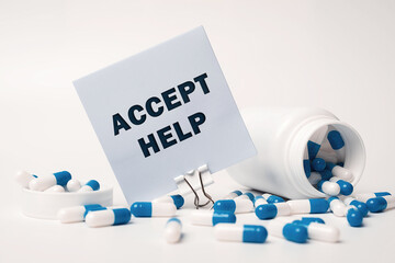 Wall Mural - Text - Accept Help, written on sticky note near blue-white pills spilling out of pill bottle. Medical concept