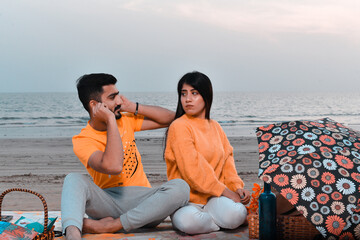 Wall Mural - young happy couple on beach indian pakistani model