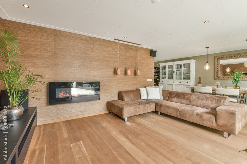 Modern living room in beige colors with comfy couch and wooden ...