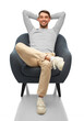© Syda Productions - people and furniture concept - happy smiling man sitting in chair over white background
