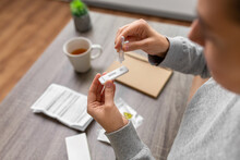 Medicine, Quarantine And Pandemic Concept - Close Up Of Woman Making Self Testing Coronavirus Test At Home