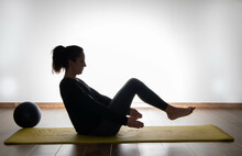 Woman Doing Pilates, Training Al Home. Series Of Exercise With Copy Space