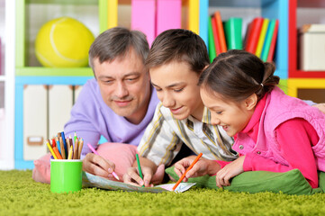 Poster - Portrait of happy father and his children drawing