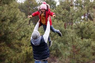 Wall Mural - Man and his daughter spending time together in forest