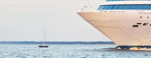 Passenger Ship (cruise Liner) Sailing In The Sea On A Clear Day. Panoramic View From A Sailing Boat. Travel Destinations, Tourism, Summer Vacations, Recreation Concepts