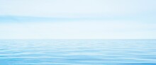 Panoramic Seascape. Clear Blue Glowing Sky, Reflections, Sea Water Surface Texture. Dreamlike Scenery. Nature, Environment, Ecology Themes. Tourism, Relaxation, Meditation Concepts
