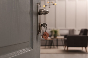 Wall Mural - Closeup view of open door with key in room