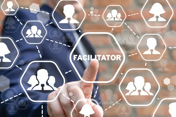 businessman using virtual touch screen clicks a facilitator word button. business concept of facilit